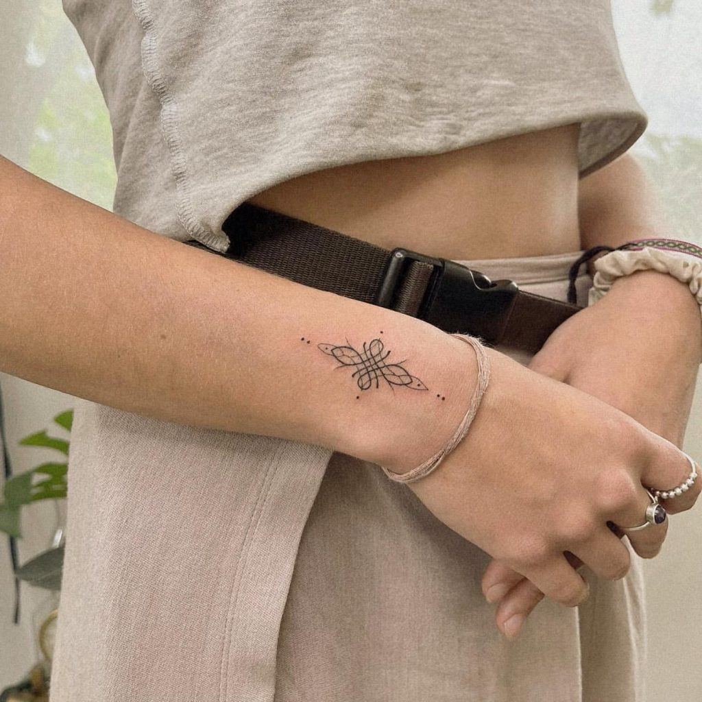 Butterflies are often seen as symbols of transformation and freedom, and this butterfly tattoo takes that symbolism to the next level with an intricate mandala design.