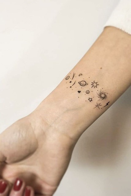 A cosmic-themed tattoo is ideal for those who look to the stars for inspiration.