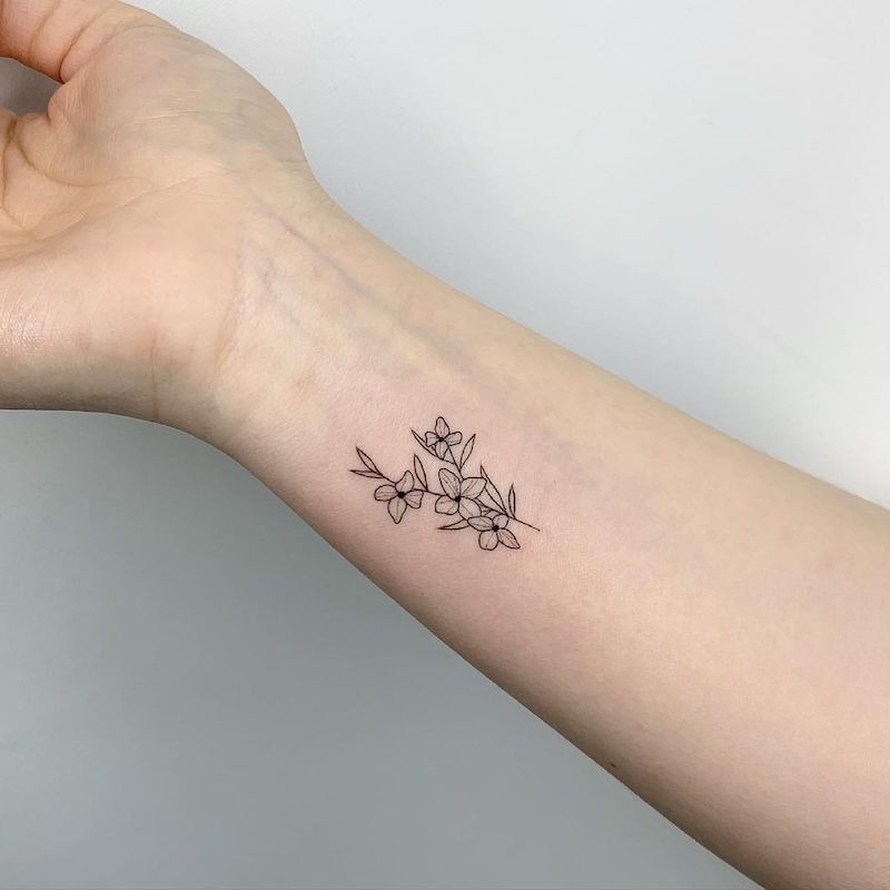 For those who appreciate the timeless beauty of nature, this small floral tattoo is a perfect choice.