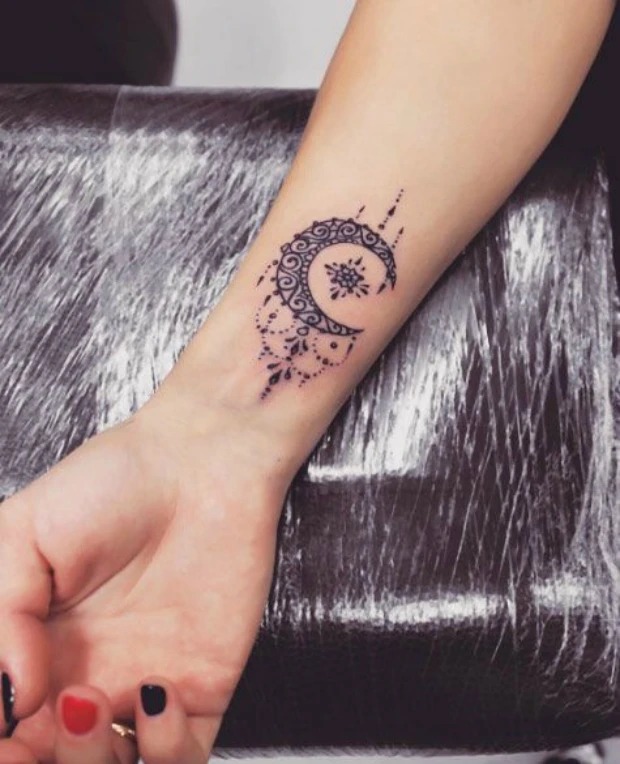 For cat lovers, this playful cat tattoo is an adorable and whimsical choice.