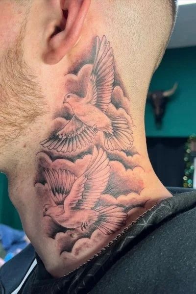 Clouds & double pigeons on the neck Tattoo Design