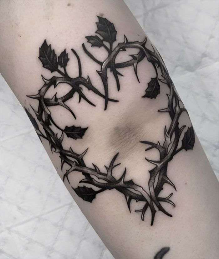 Abstract Black Vortex Around the Elbow Tattoo Design