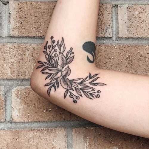 Vortex of Skulls Around the Elbow Tattoo Design