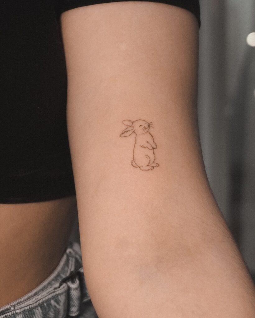 Cute Fine Line Bunny Tattoo on Arm Tattoo Design