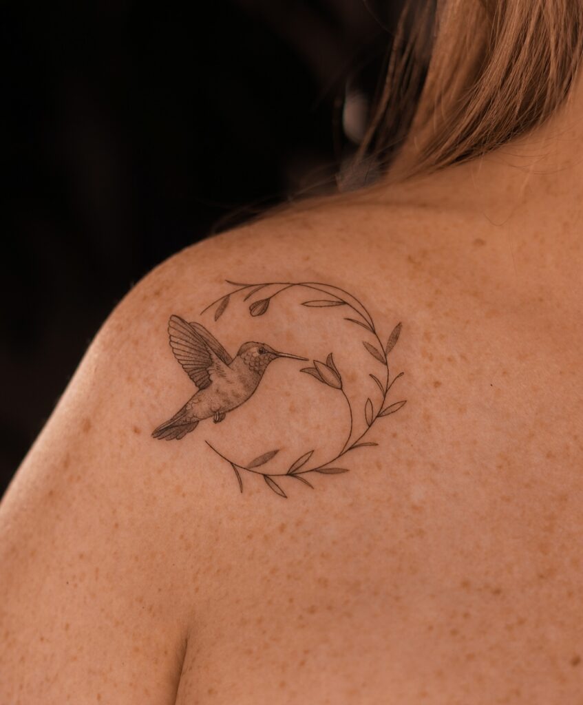 Fine Line Hummingbird with Leaves on Shoulder Tattoo Design