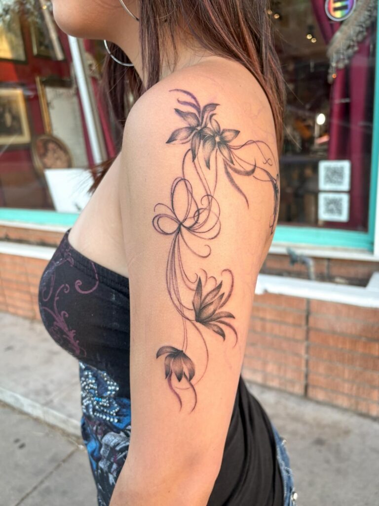 Flowing Floral Shoulder and Arm Tattoo Tattoo Design