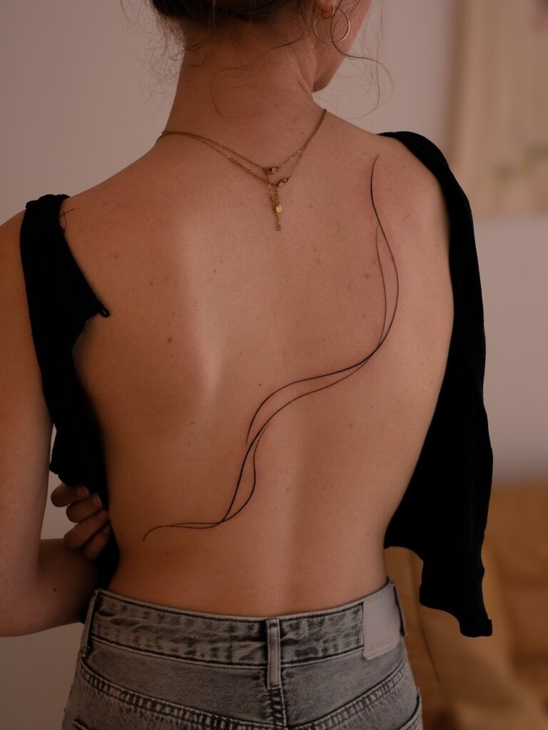 Minimal Fine Line Flow Tattoo on Back Tattoo Design
