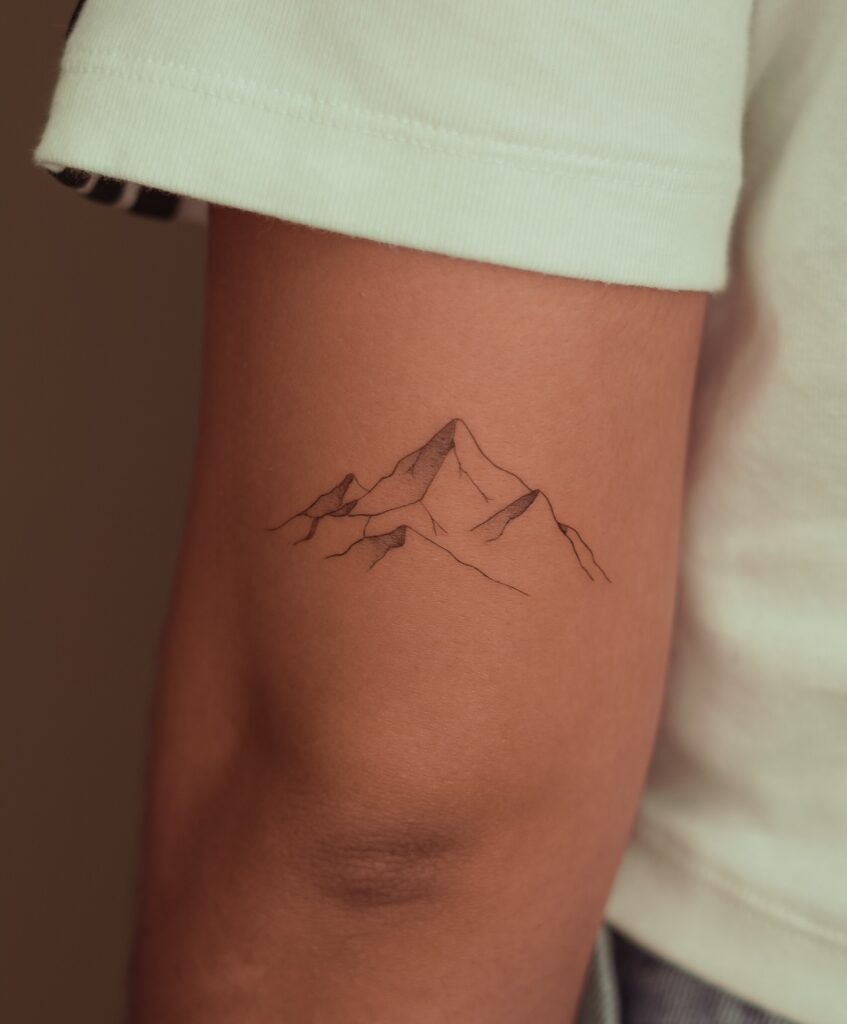Minimal Fine Line Mountain Tattoo on Arm Tattoo Design