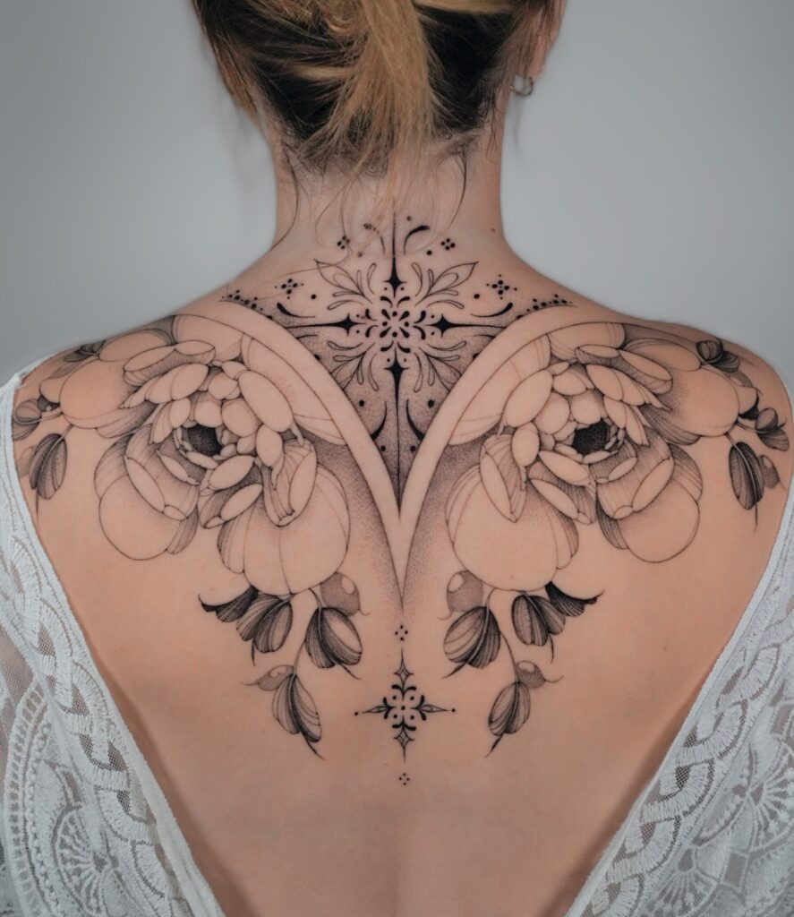 Ornamental Floral Back Tattoo with Fine Details Tattoo Design
