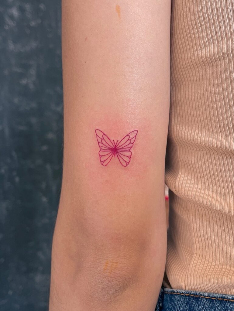 Pink Fine Line Butterfly Tattoo on Arm Tattoo Design