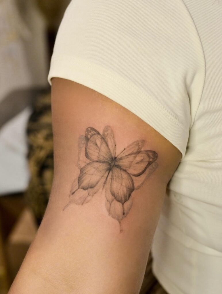 Shaded Fine Line Butterfly Tattoo on Arm Tattoo Design