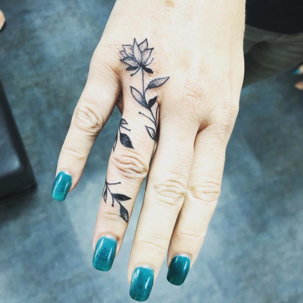 Bold Lotus Vine Finger Tattoo Tattoo Design