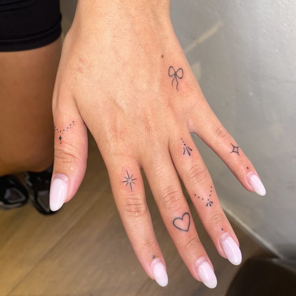 Bow and Heart Finger Tattoos Tattoo Design