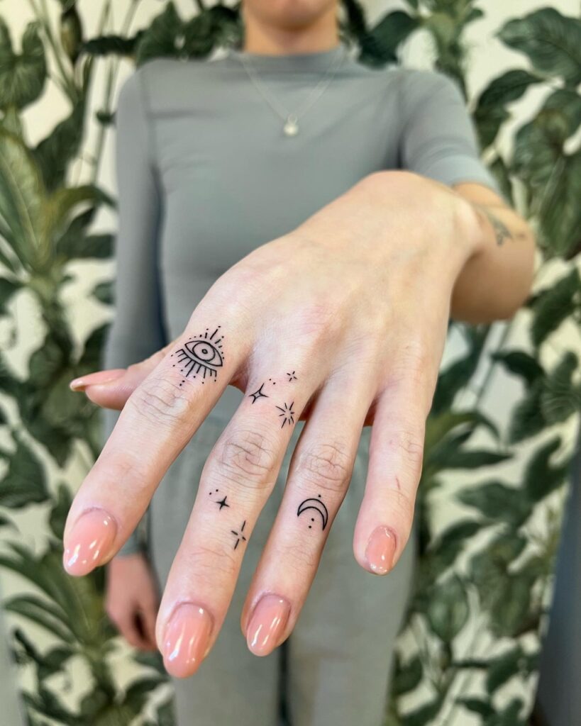 Eye and Star Finger Tattoos Tattoo Design
