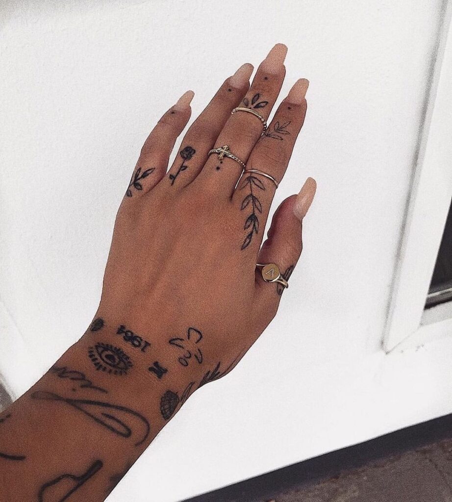 Floral and Symbolic Finger Tattoos Tattoo Design
