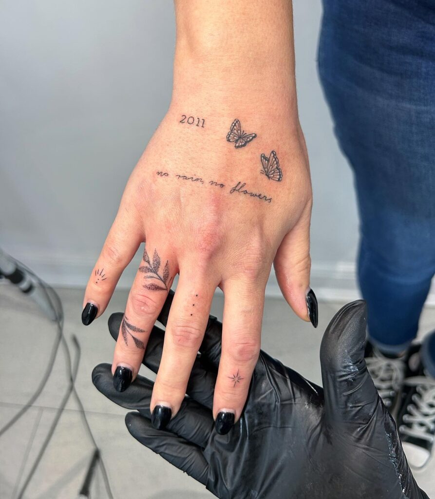 Leaf and Star Finger Tattoos with Hand Script Tattoo Design