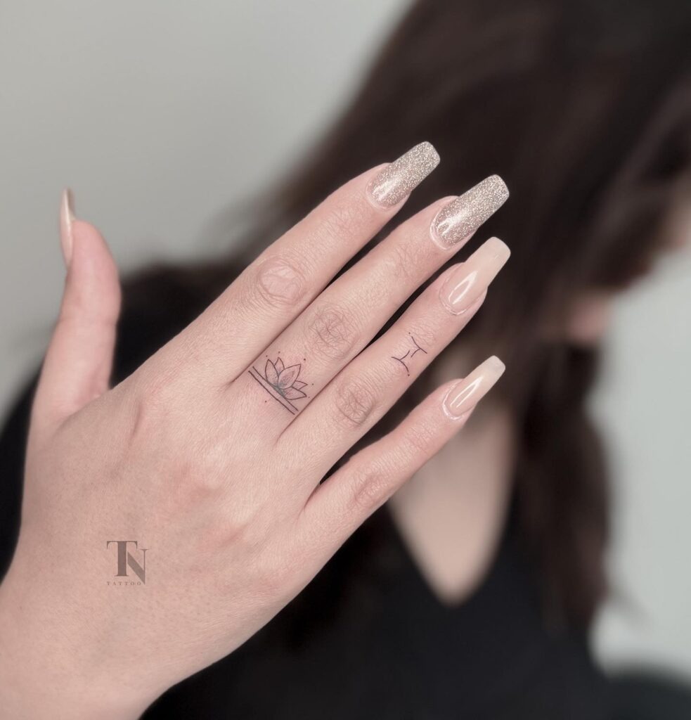 Lotus and Gemini Finger Tattoo Tattoo Design