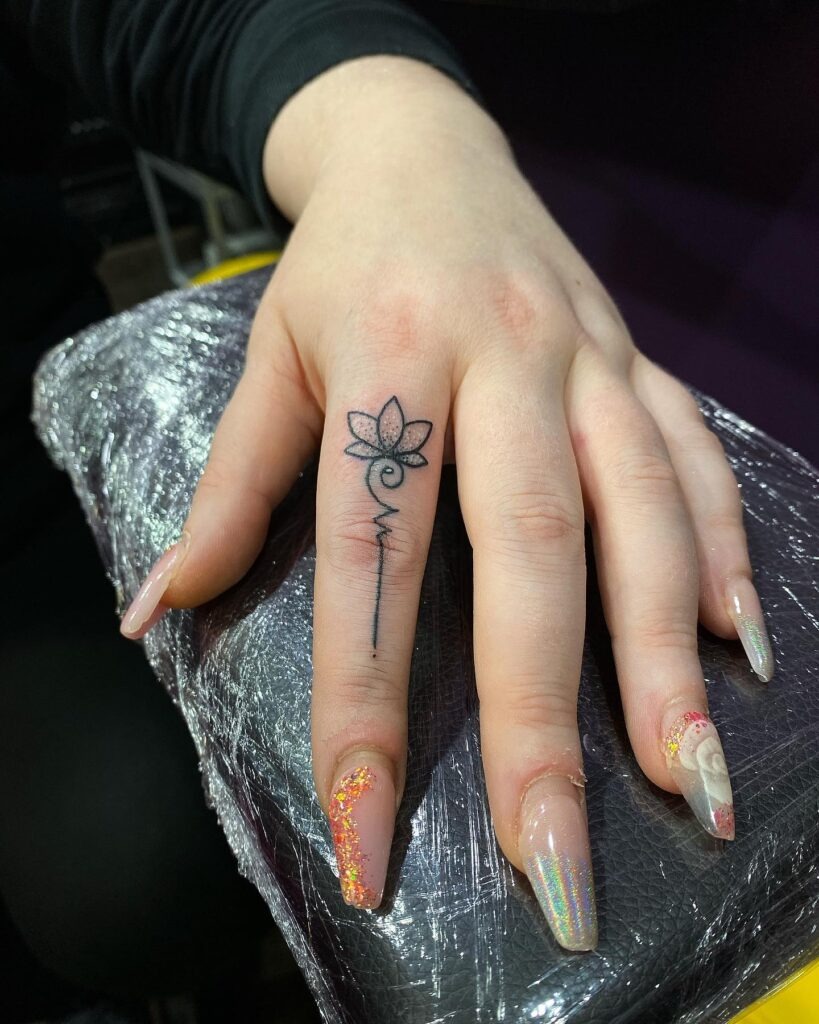 Lotus with Flowing Stem Finger Tattoo Tattoo Design