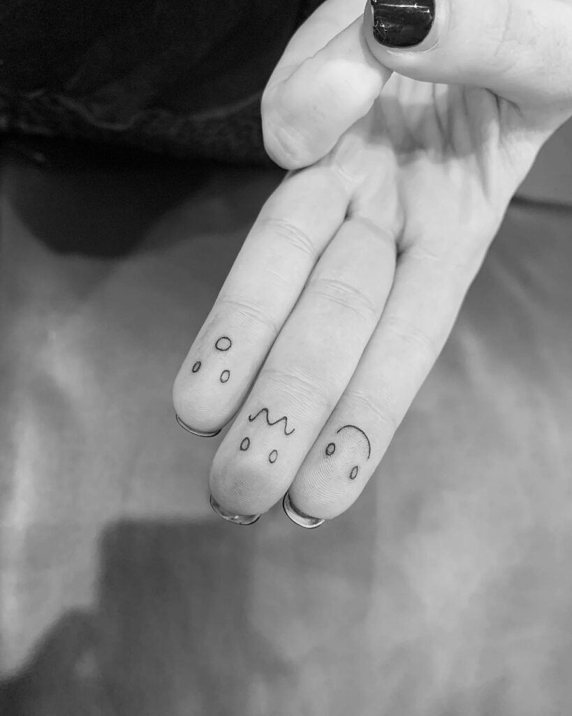 Playful Ghost Finger Tattoo Tattoo Design