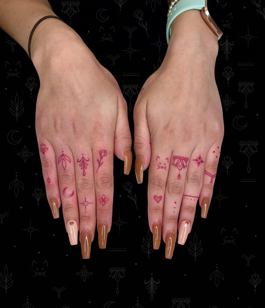 Red Ink Floral and Star Finger Tattoos Tattoo Design