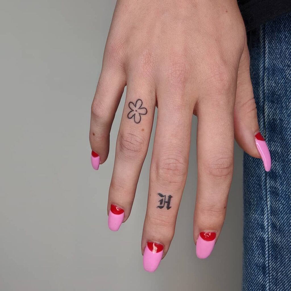 Simple Flower and Letter Finger Tattoos Tattoo Design