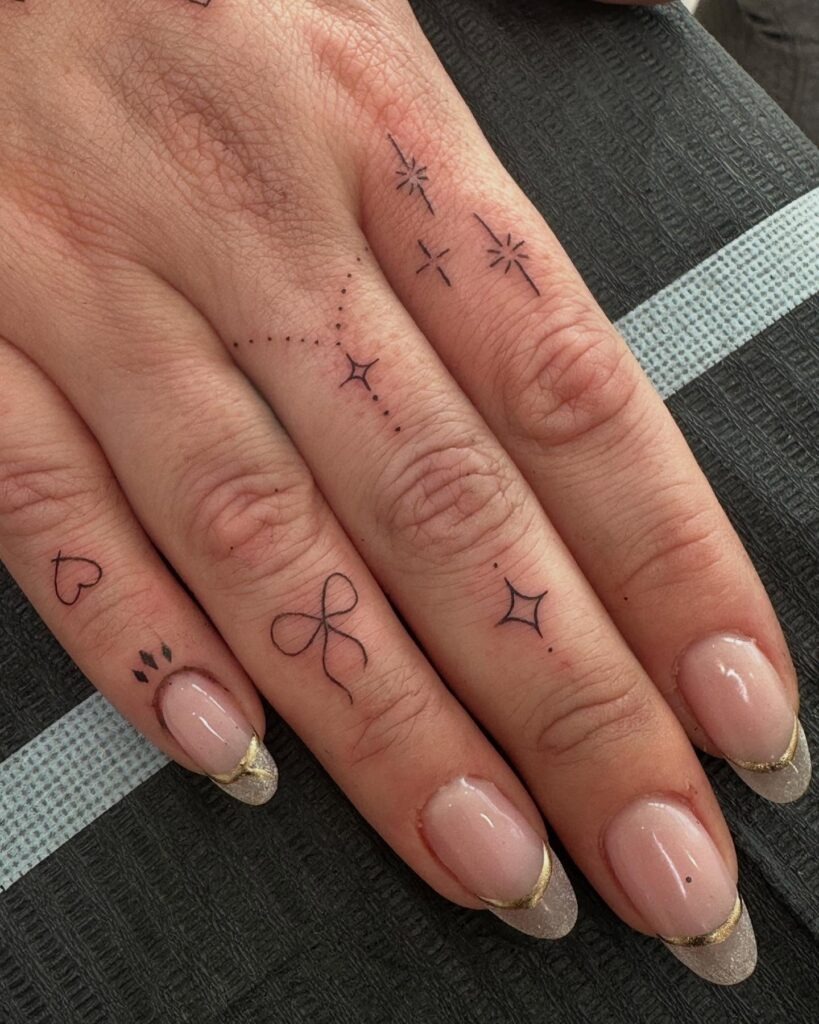 Stars and Bow Finger Tattoos Tattoo Design
