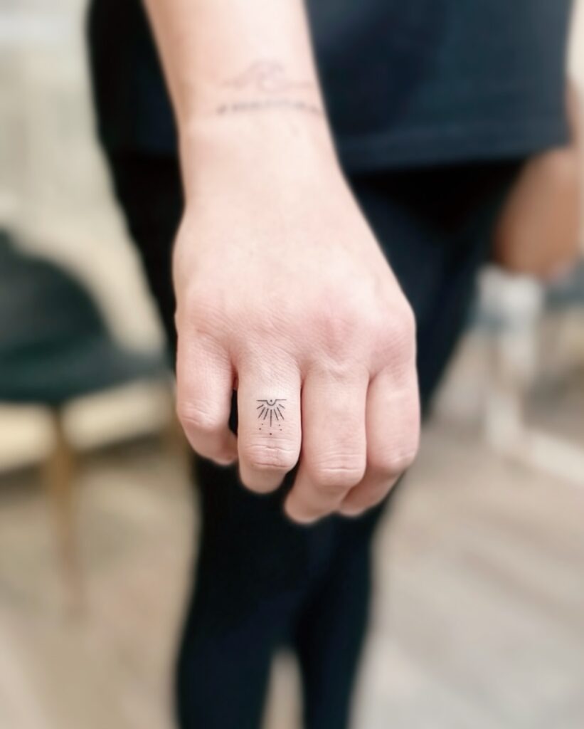 Tiny Rising Sun Finger Tattoo Tattoo Design
