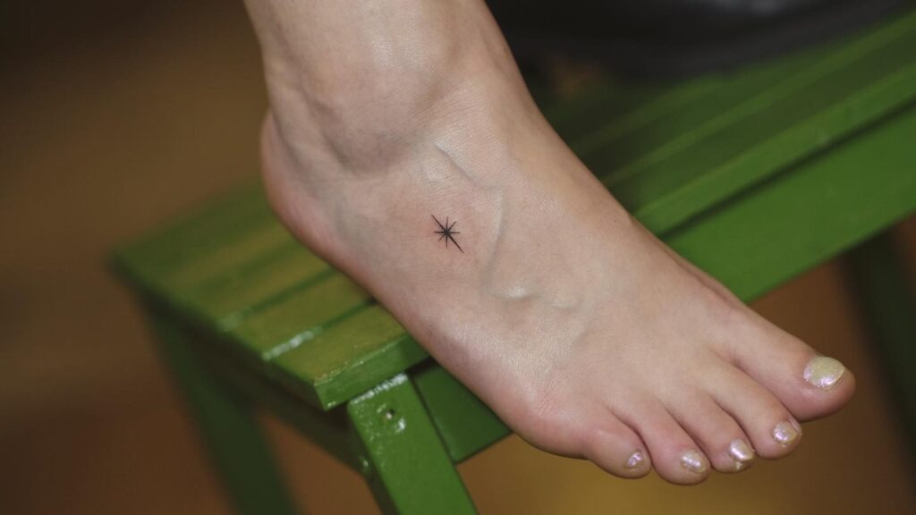 Delicate Floral Foot Tattoo with Butterfly Tattoo Design