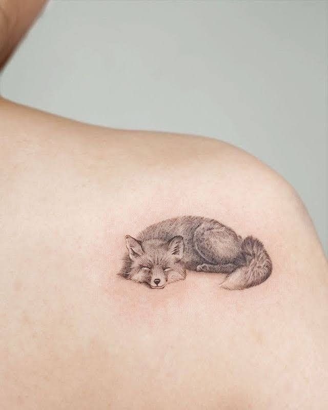 Tiny Sleeping Fox in Black and White Tattoo Design
