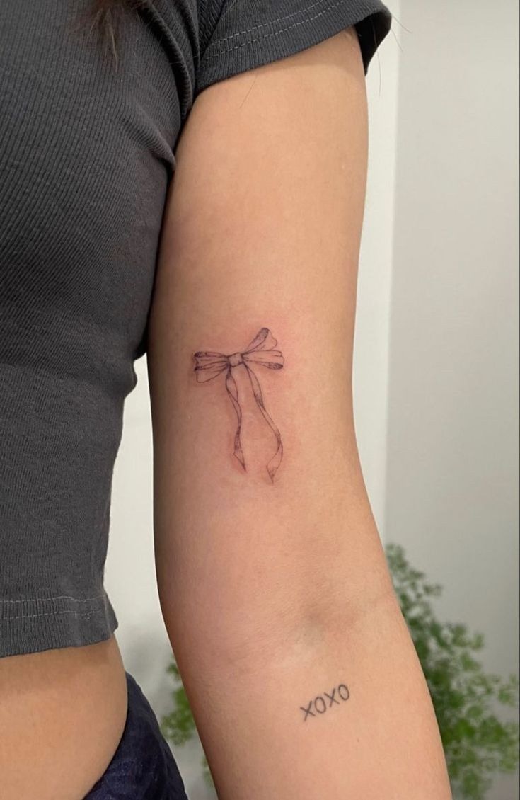 Delicate Bow Tattoo on Arm Tattoo Design