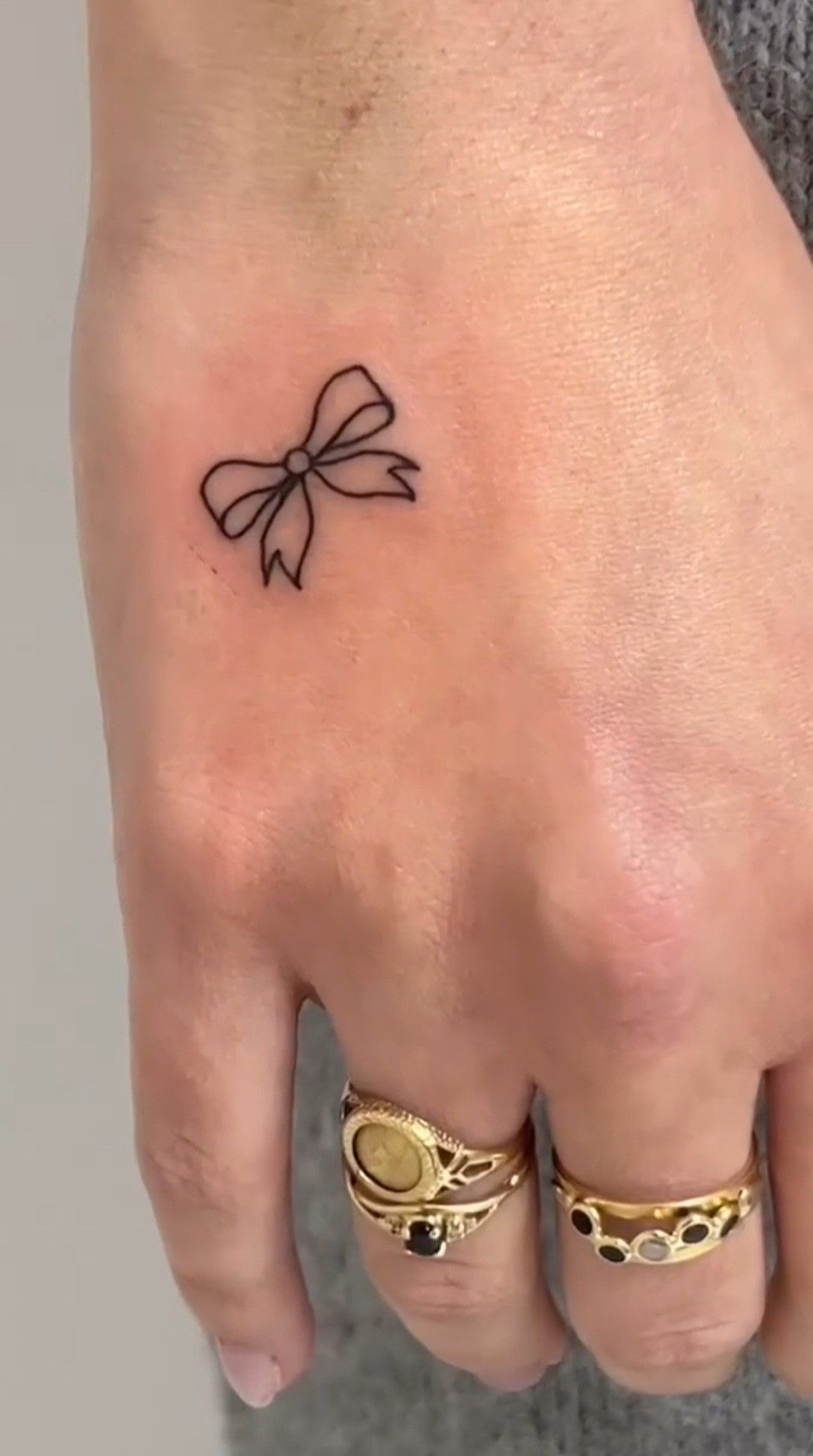 Minimal Bow Hand Tattoo Tattoo Design