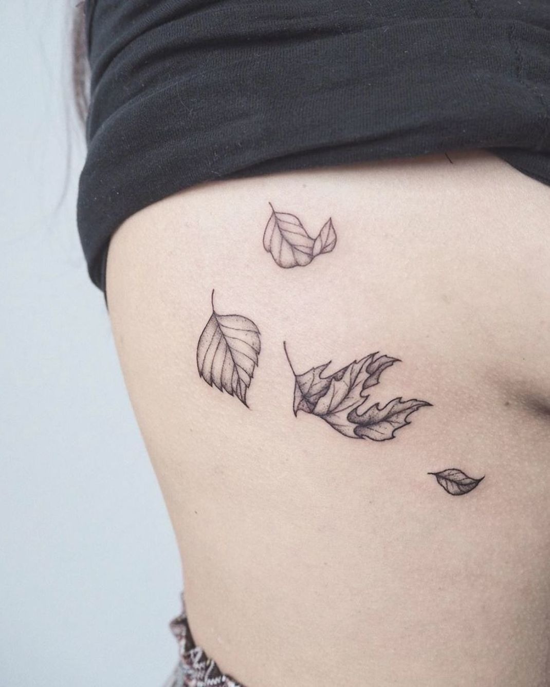 Windblown Fine Line Leaves Tattoo Design