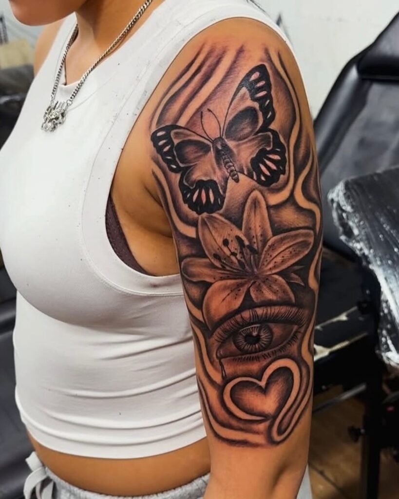 Butterfly, Flower, and Eye Half Sleeve Tattoo Tattoo Design