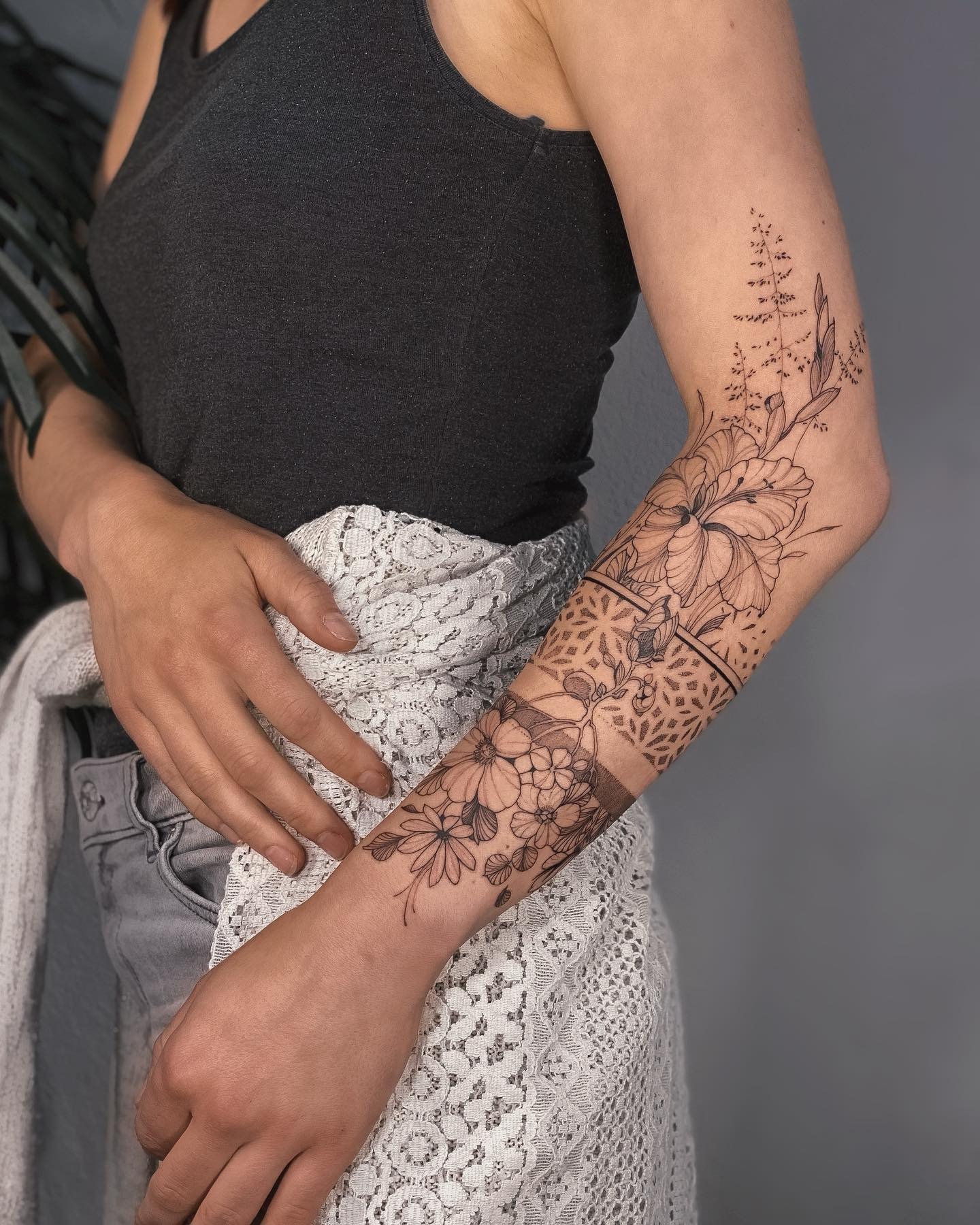 Floral Half Sleeve Tattoo with Geometric Accents Tattoo Design