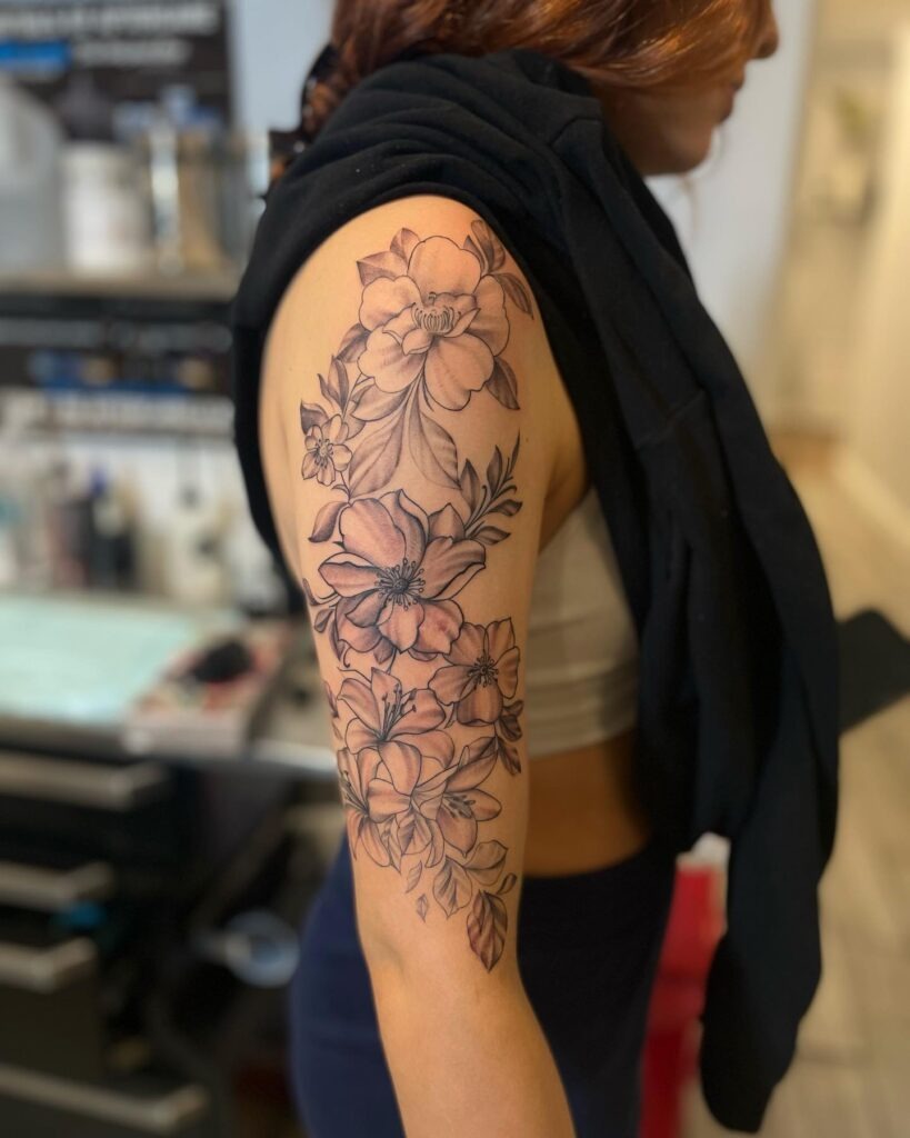 Floral Half Sleeve Tattoo with Layered Blossoms Tattoo Design