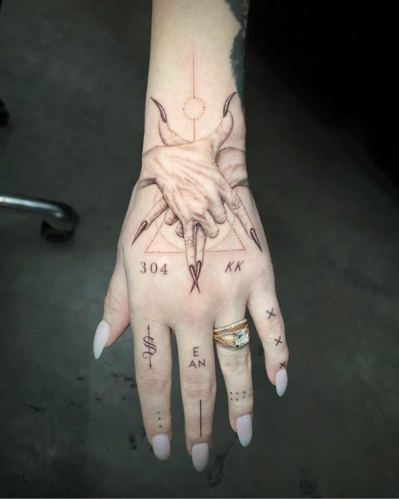 Bold Blackwork Beetle and Floral Hand Tattoo Tattoo Design