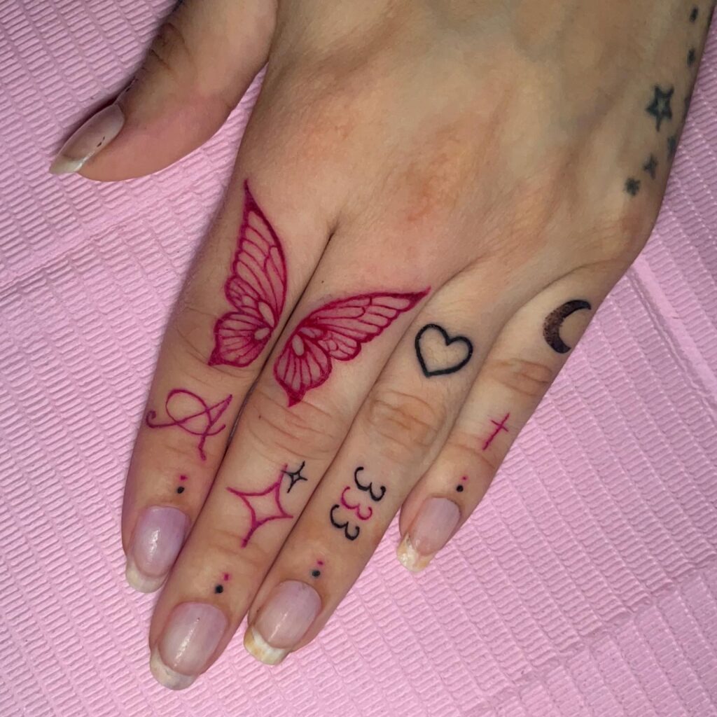 Bold Spiral and Sunburst Hand Tattoo Tattoo Design