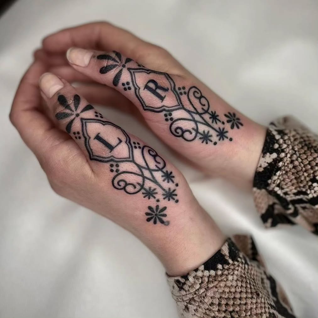 Hand Tattoos with Floral and Symbolic Motifs Tattoo Design