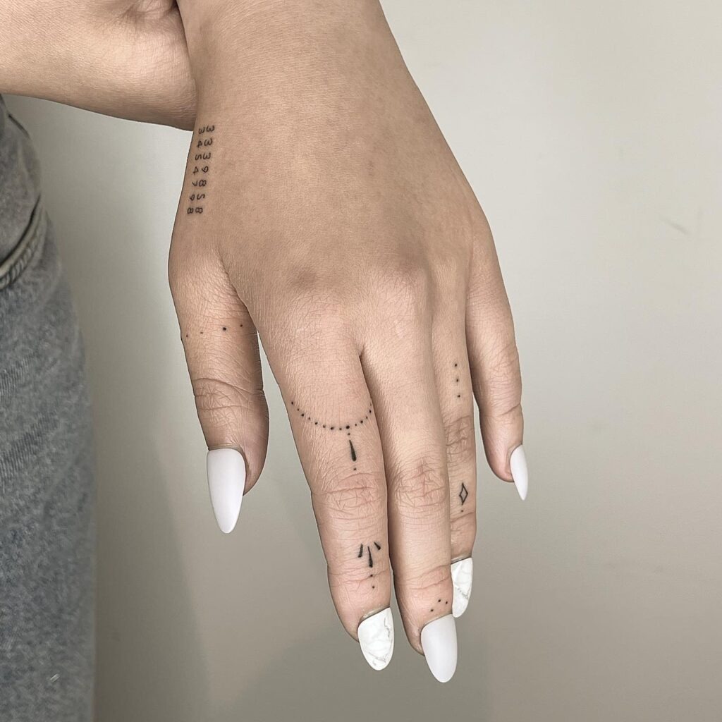 Serene Minimalist Nature and Celestial Hand Tattoo Tattoo Design
