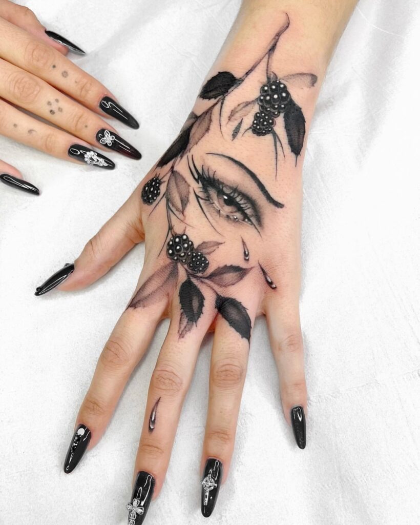 Whimsical Red Butterfly and Symbols Hand Tattoo Tattoo Design