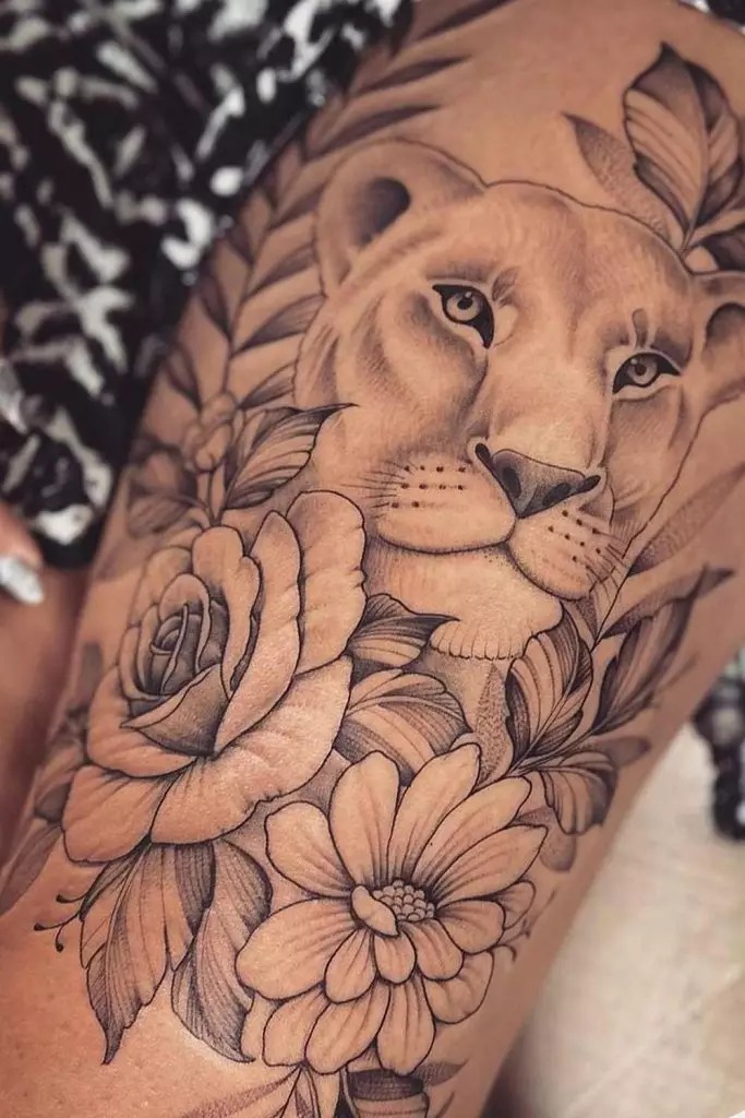 Lion and Floral Composition on Thigh Tattoo Design