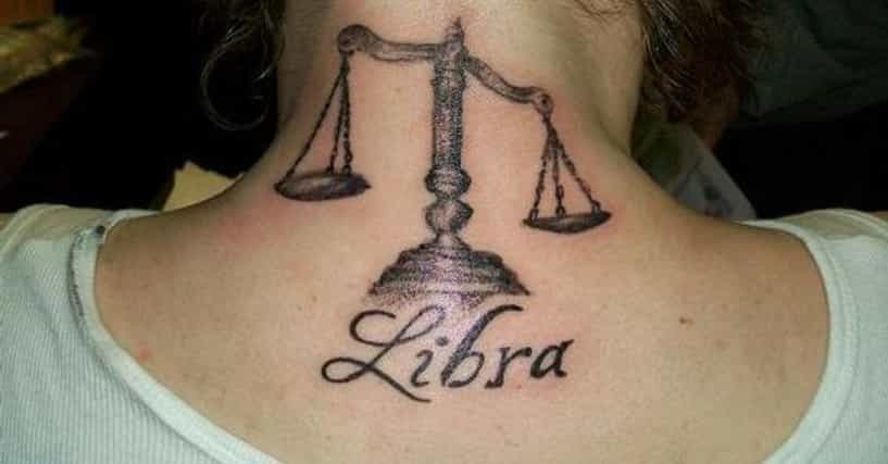 This bold neck tattoo prominently displays a set of scales with the word "Libra" elegantly scripted beneath it.