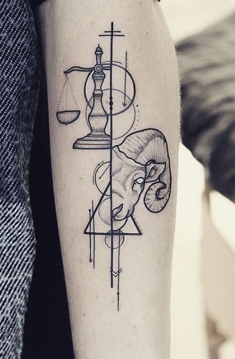 A unique fusion of the Libra scales and a ram's head, this tattoo hints at the blend of Libra and Aries energies, possibly representing a birth chart or significant personality traits.