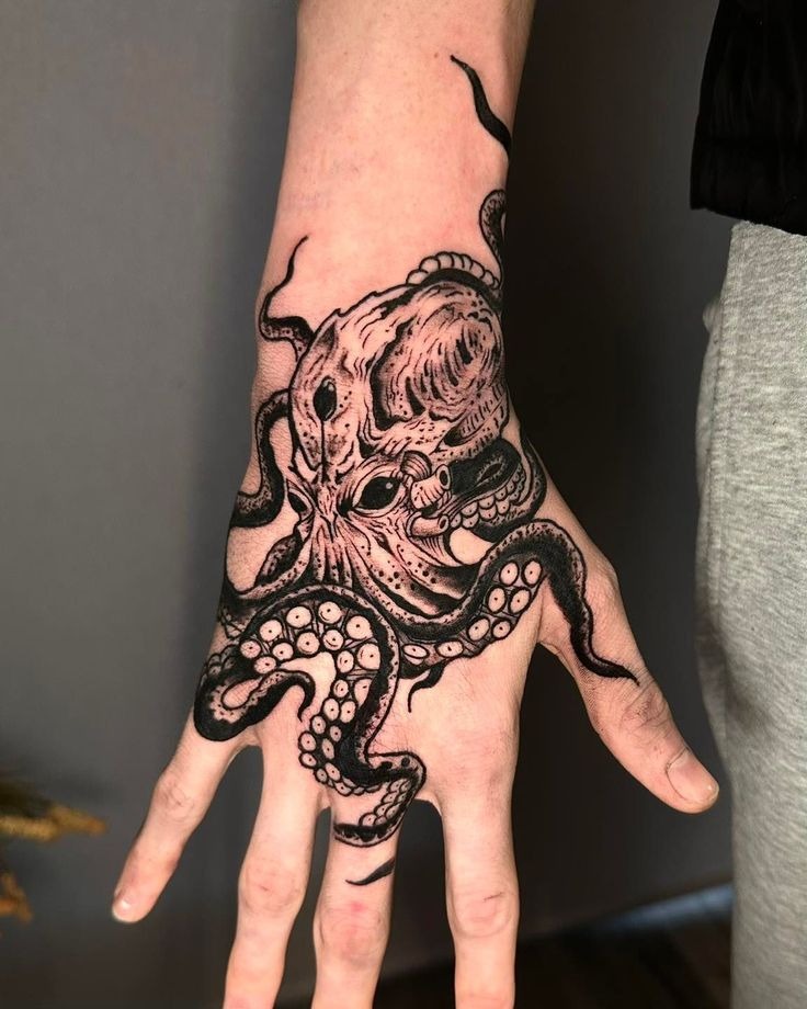 Bold Octopus Hand Tattoo, a tattoo design rendered in clean detailed linework for the wrist.