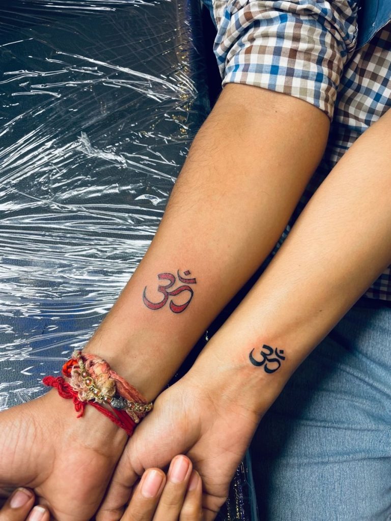 Lotus-Stem Om In Bloom Tattoo Design