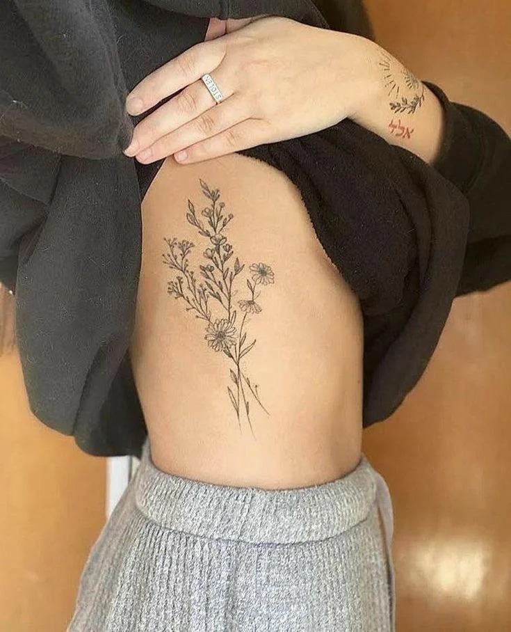 Delicate Floral Arrangement Tattoo Design