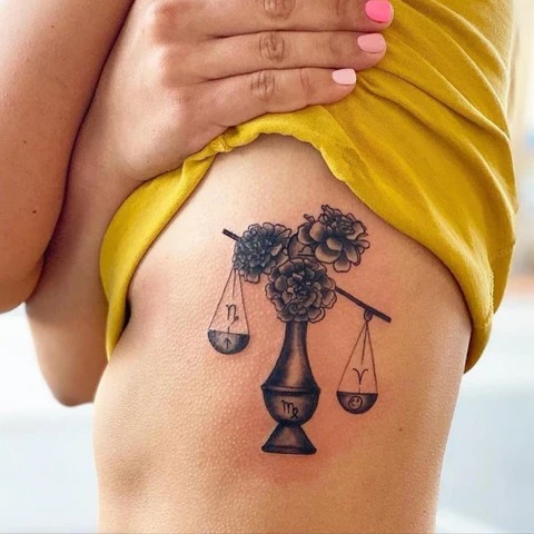 Zodiac-Inspired Floral Balance Tattoo Design