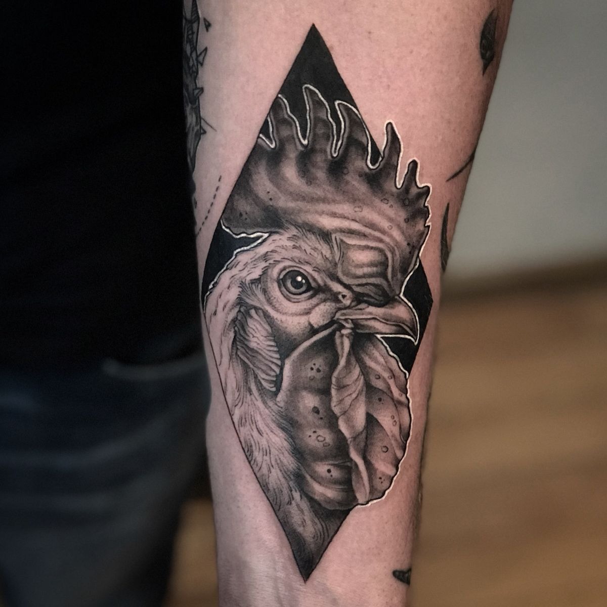 Monochrome Rooster Portrait In A Diamond Frame Tattoo Design
