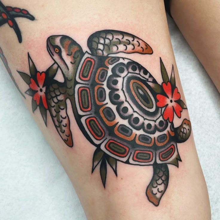 The tattoo combines traditional Hawaiian art styles with contemporary elements through its bold design.