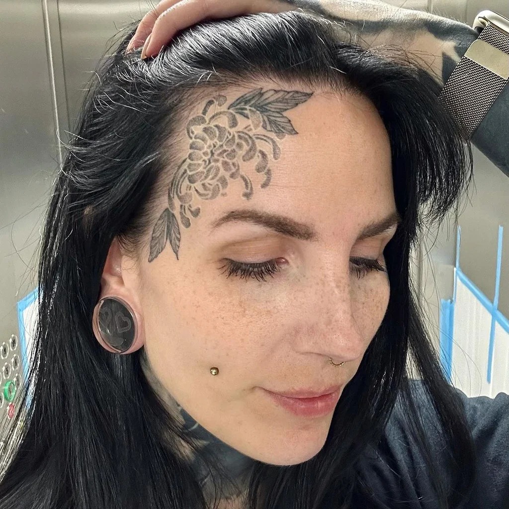 Floral Forehead Masterpiece Tattoo Design